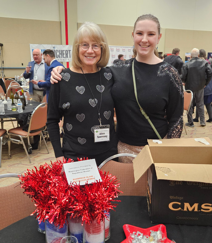 Bainbridge President Alice Tawresey with table decorations. Bainbridge member Elizabeth Doll ( also Roanoke board member